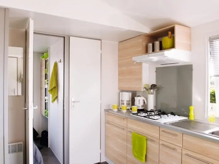 The mobile home kitchen with hob, sink and storage
